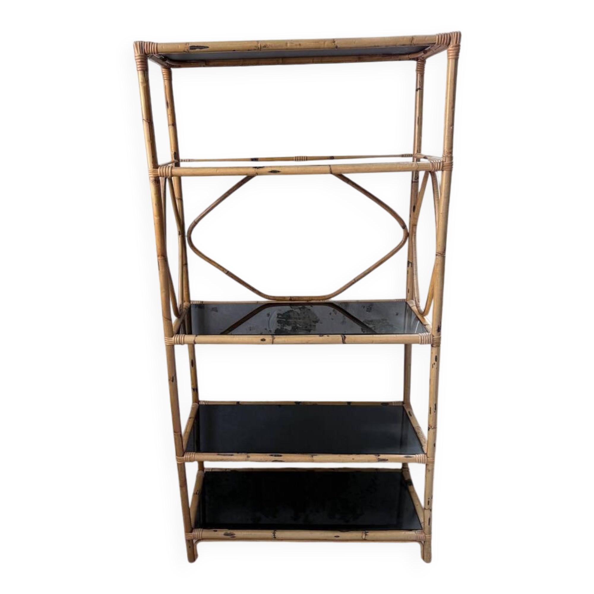 Rattan bookshelf and black glasses