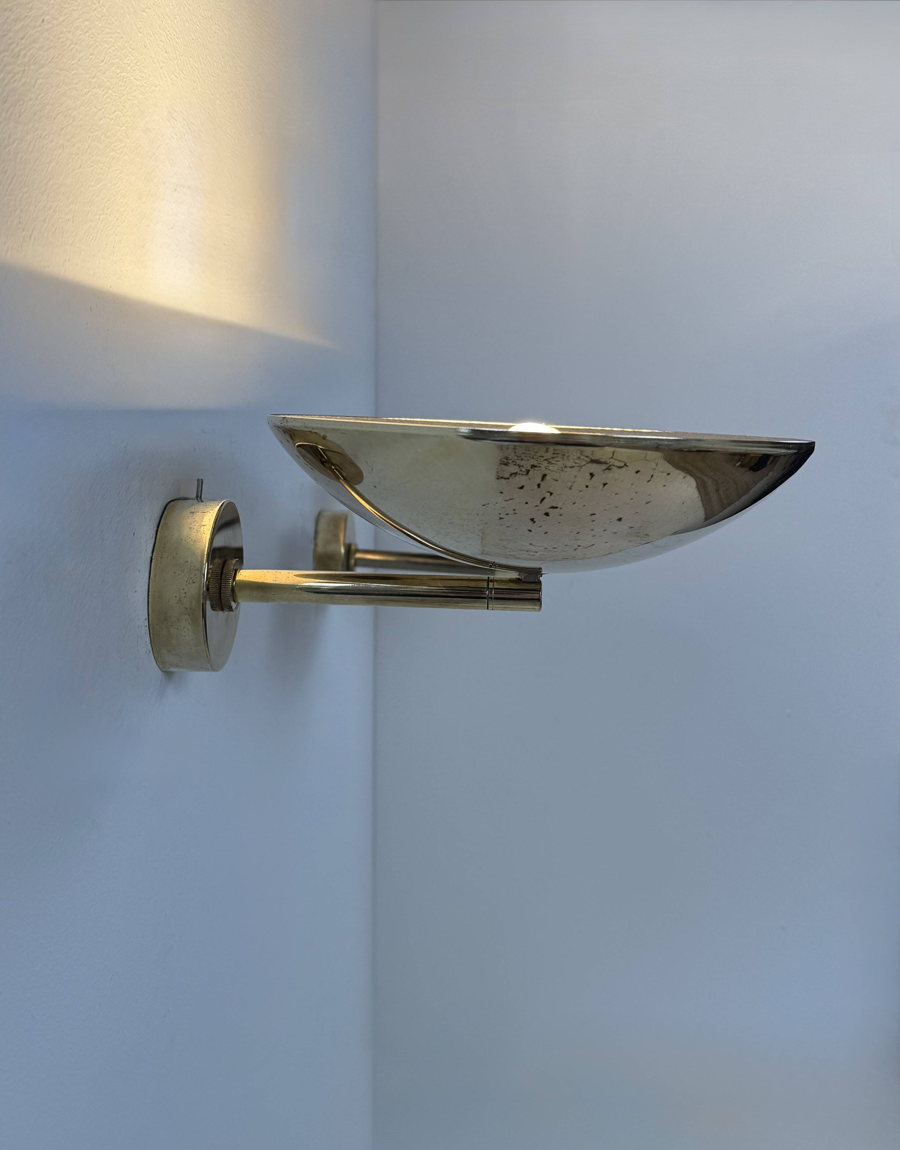 Pair of adjustable vintage wall lights, patinated brass, France, 1970.