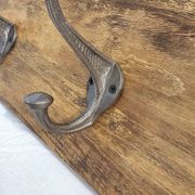 Teak coat rack with 8 double cast iron hooks