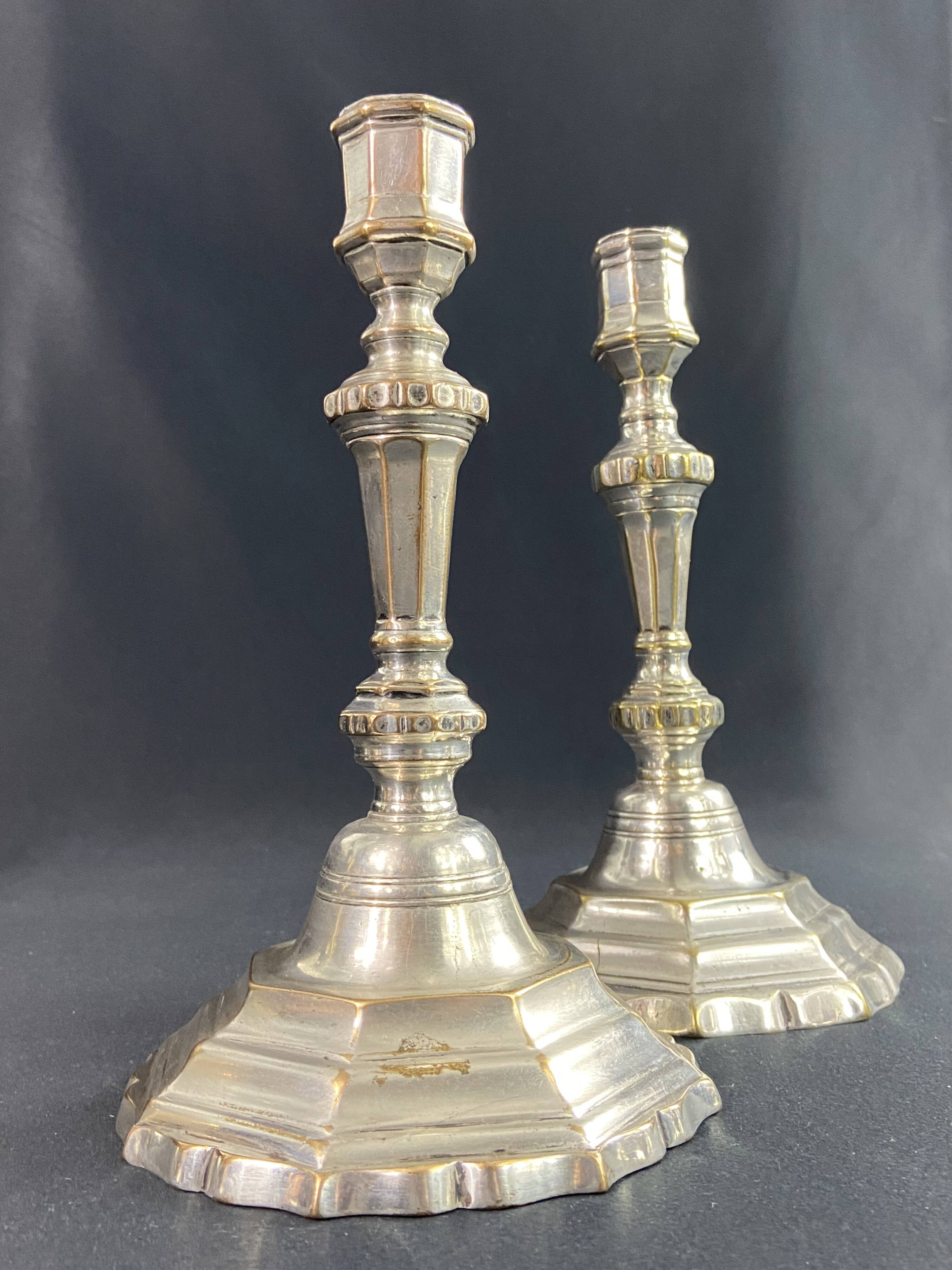 Pair of 18th century Regency candlesticks in silvered bronze