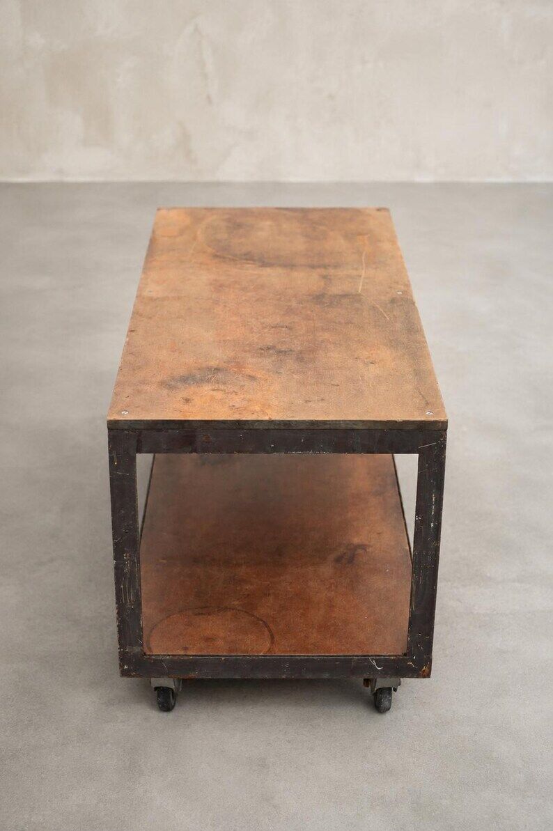 Industrial coffee table in metal and wood, wheeled table, trolley, vintage table, interior decoration.