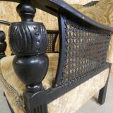 Old armchair upholstered in velvet, carved and caned wood