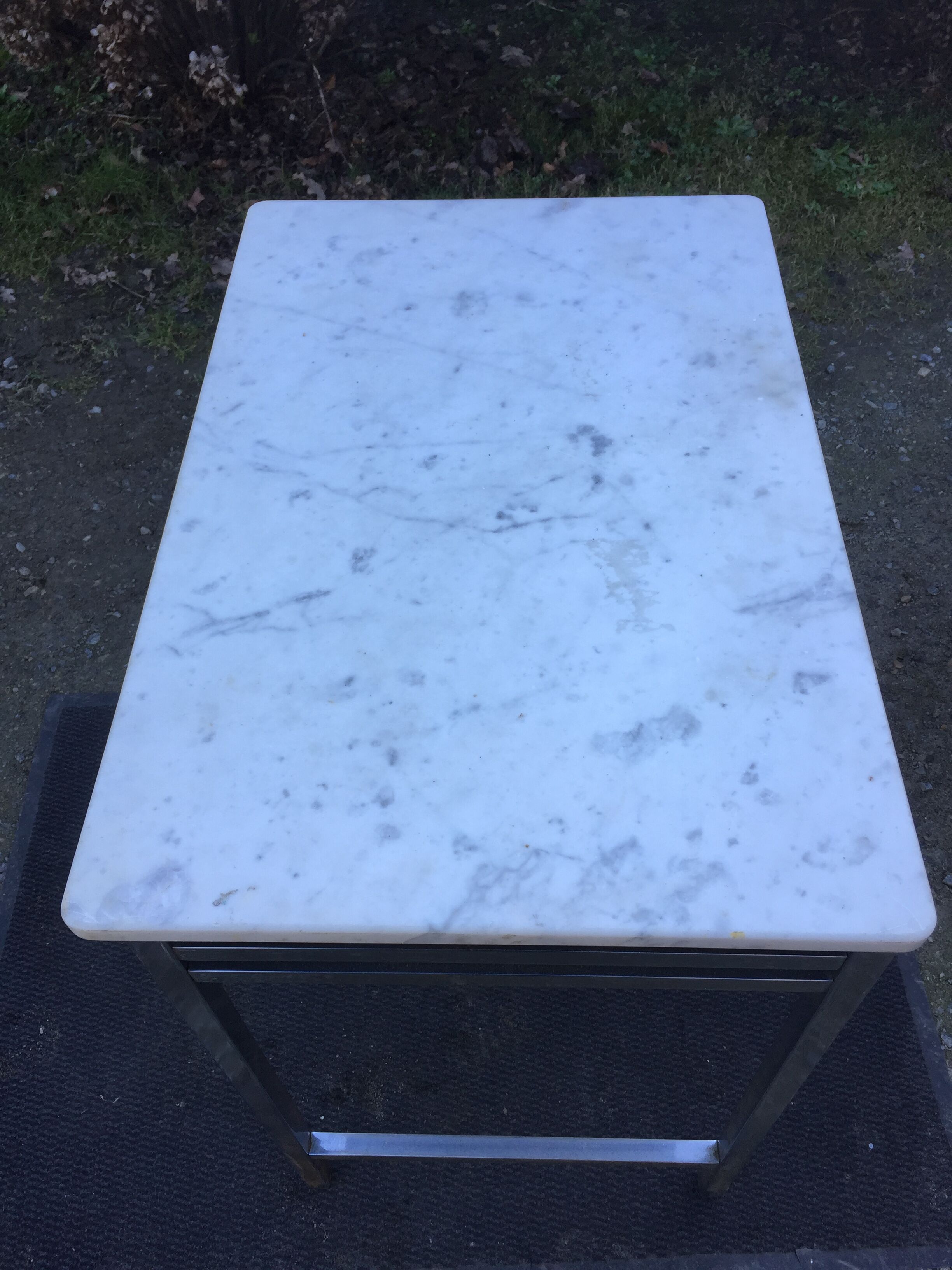 Vintage table with square chrome tubular metal base and marble top.