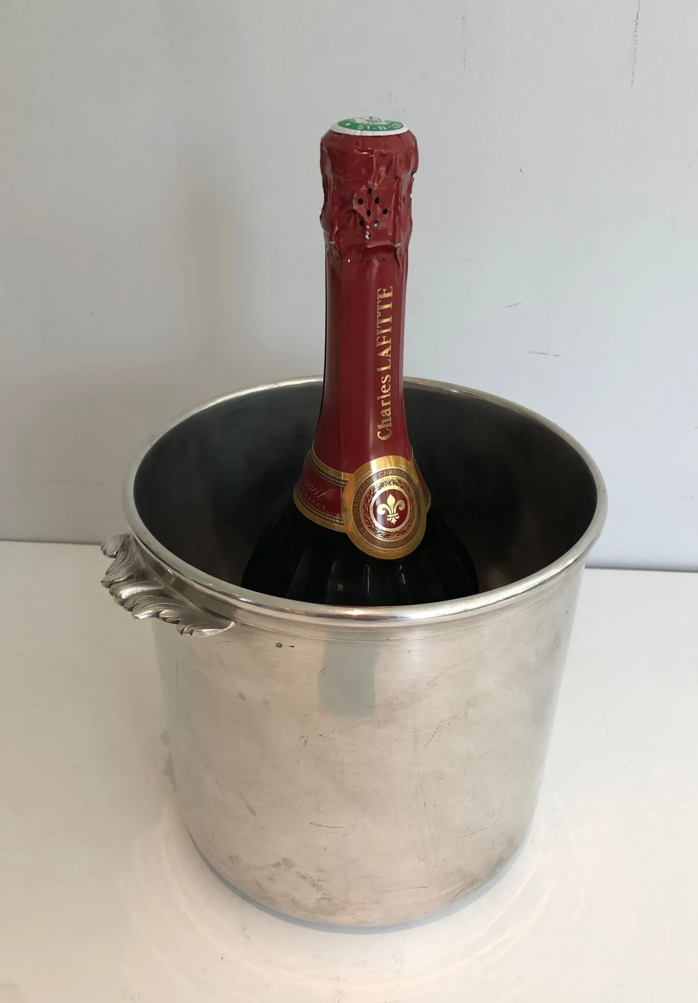 Cylindrical Silver-Plated Champagne Bucket with Small Leaf-Shaped Handles.