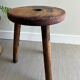 Three-legged wooden stool