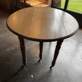 Old wooden table with folding flaps