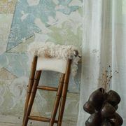 Folding stool, reupholstered in long-haired sheepskin, mid-century modern style, 1950s.