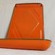 Orange enamelled kitchen utensil door