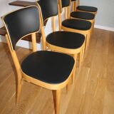 5 baumann chairs with large backs in black faux leather.