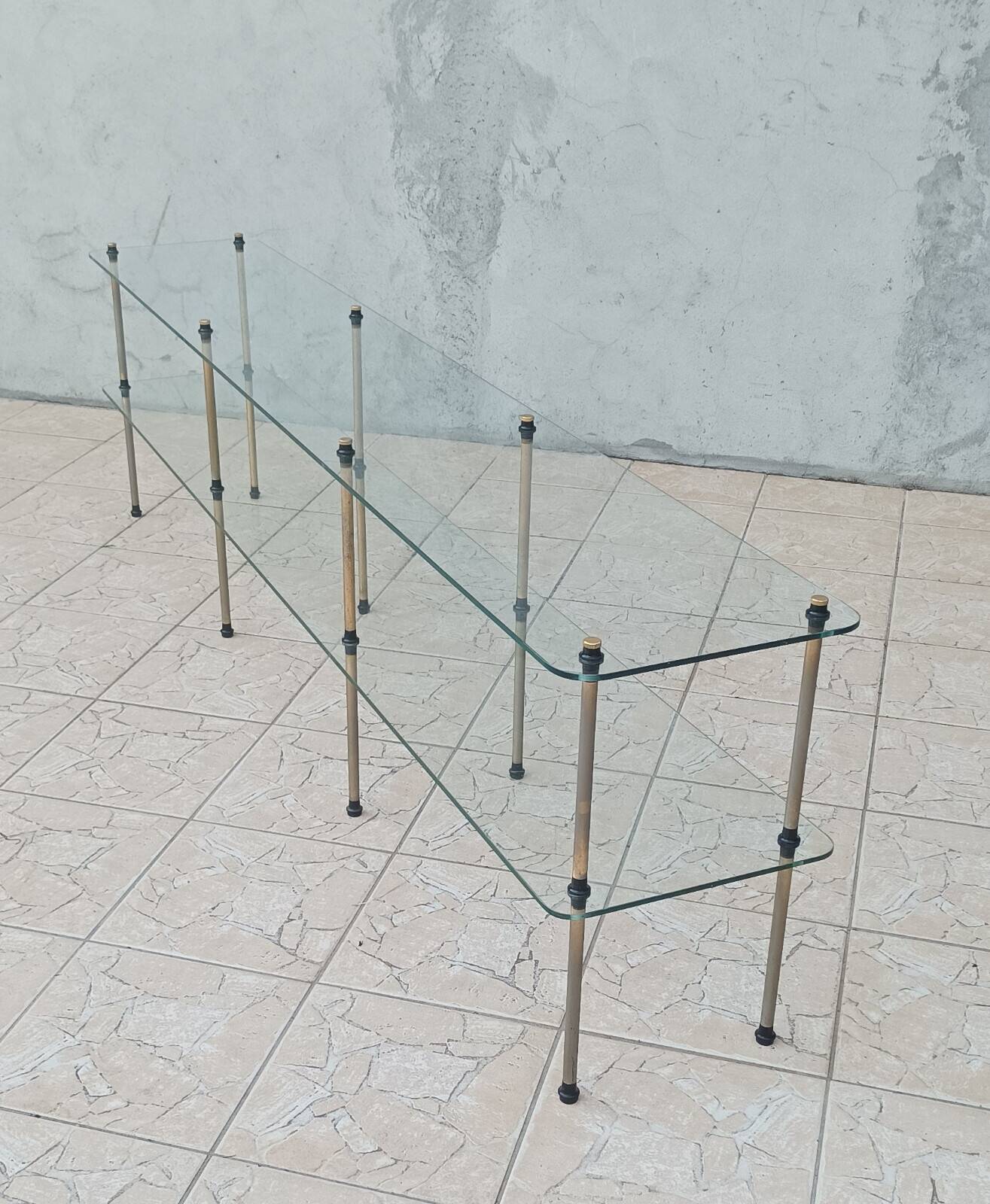 Large vintage metal and glass shop display shelf.