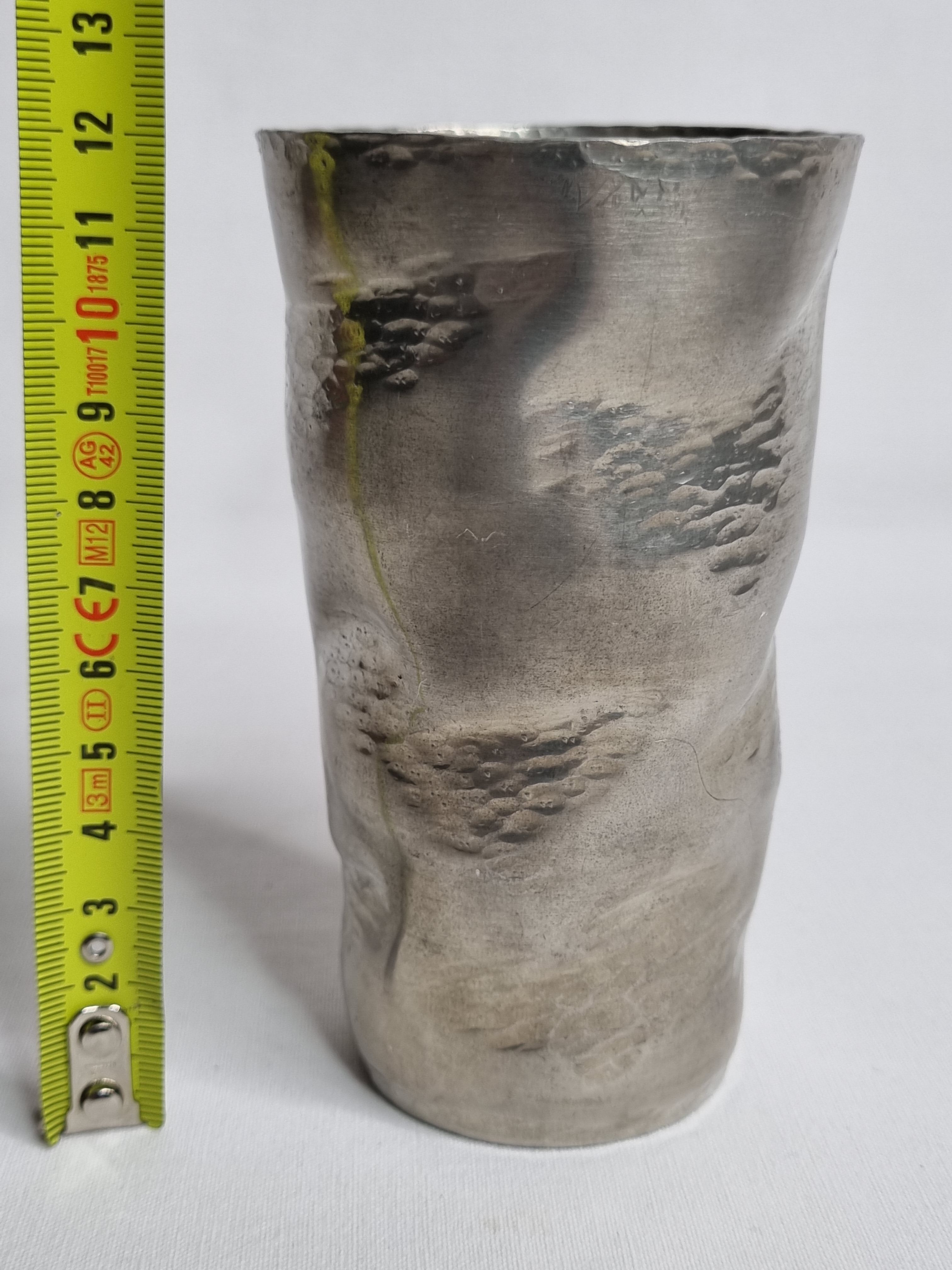 Hammered tin cup, signed