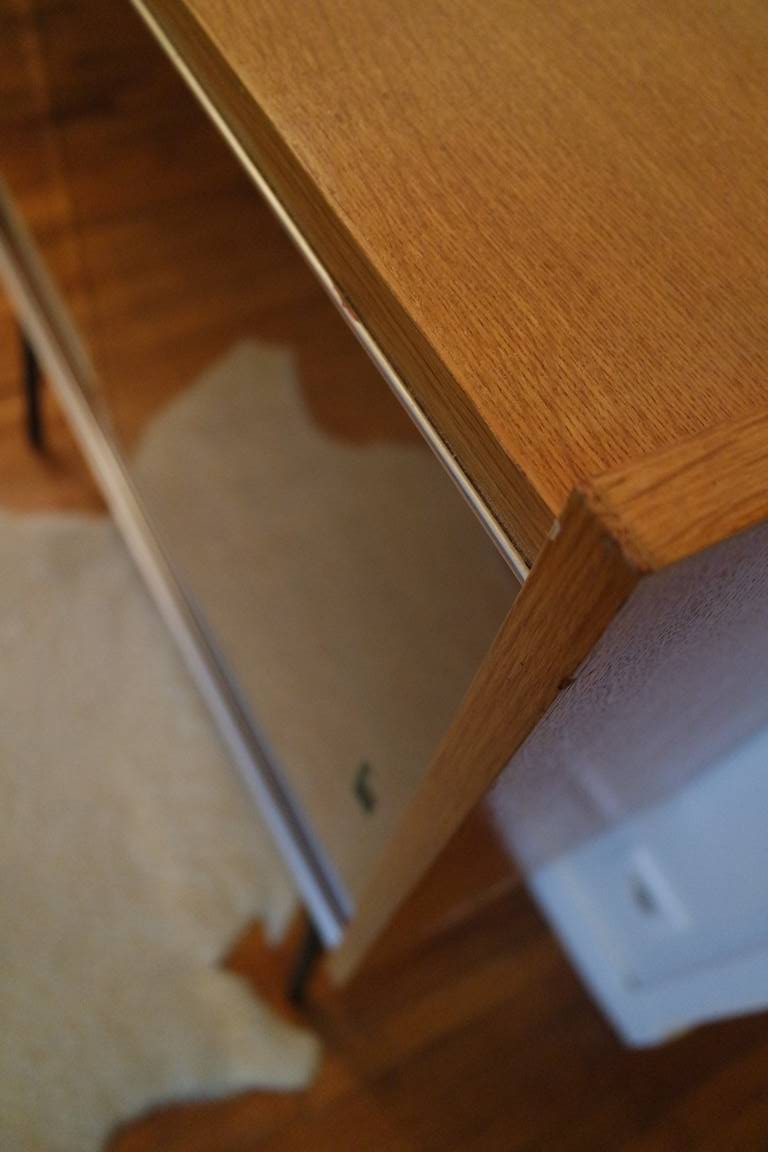 Small window on high metal feet