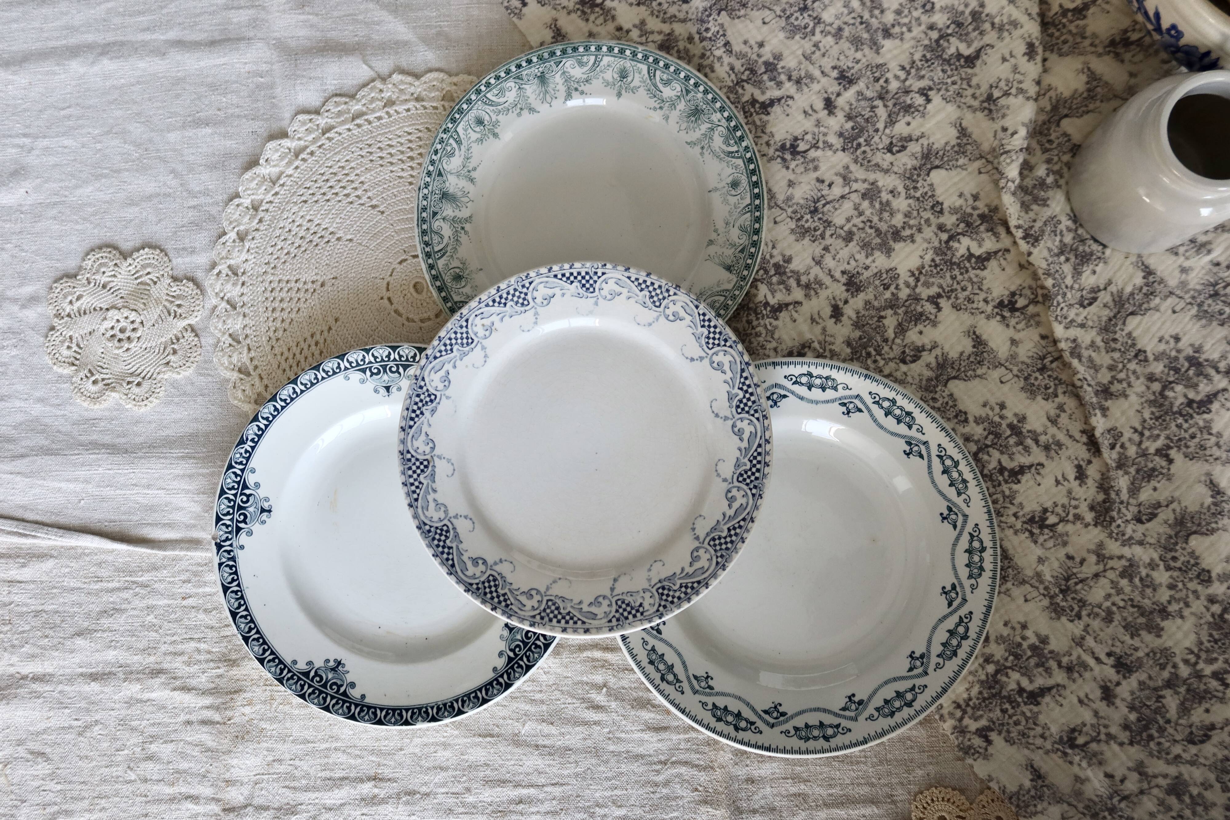Mismatched vintage flat plates in green and blue ironstone.