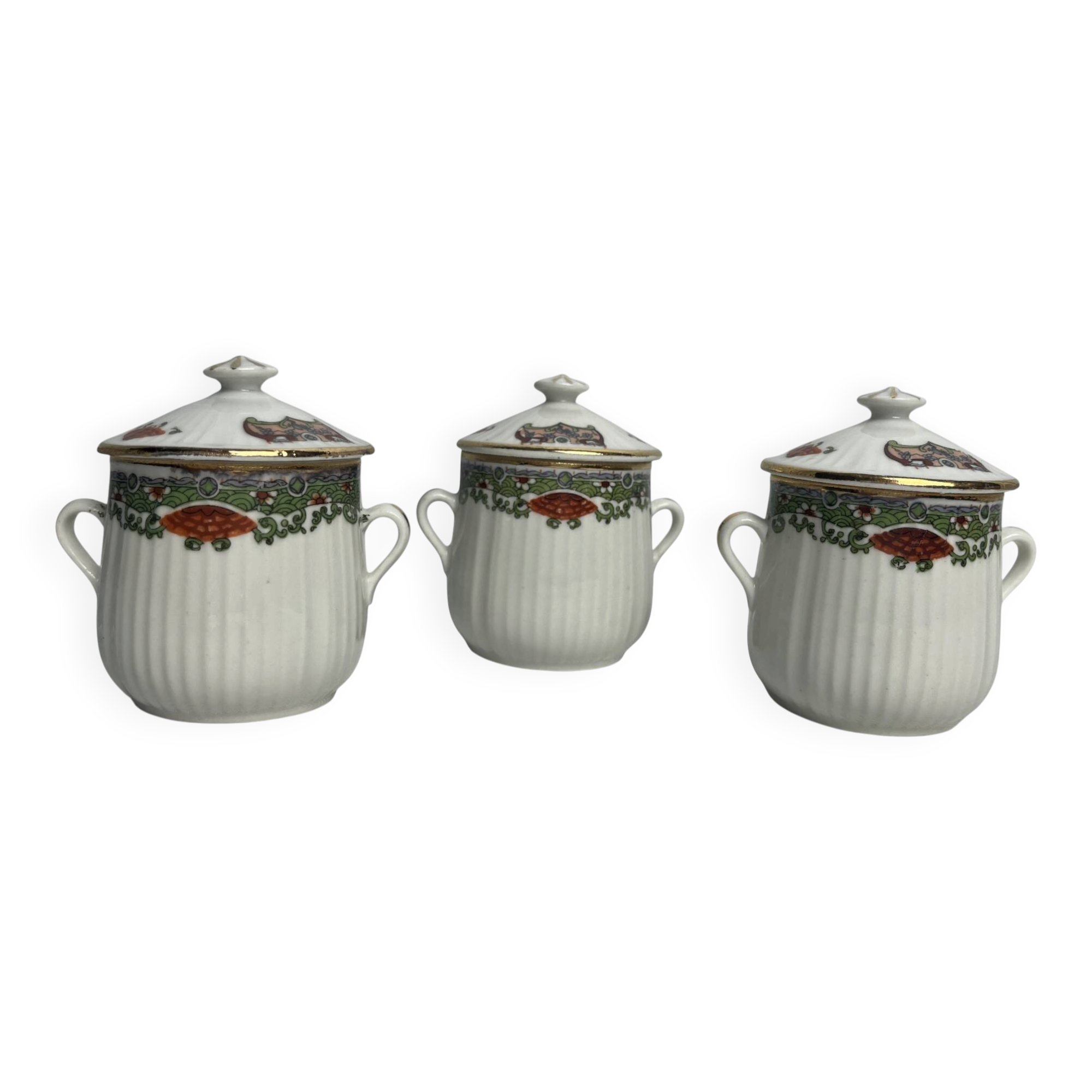 Set of three ribbed porcelain cream pots, 20th century.