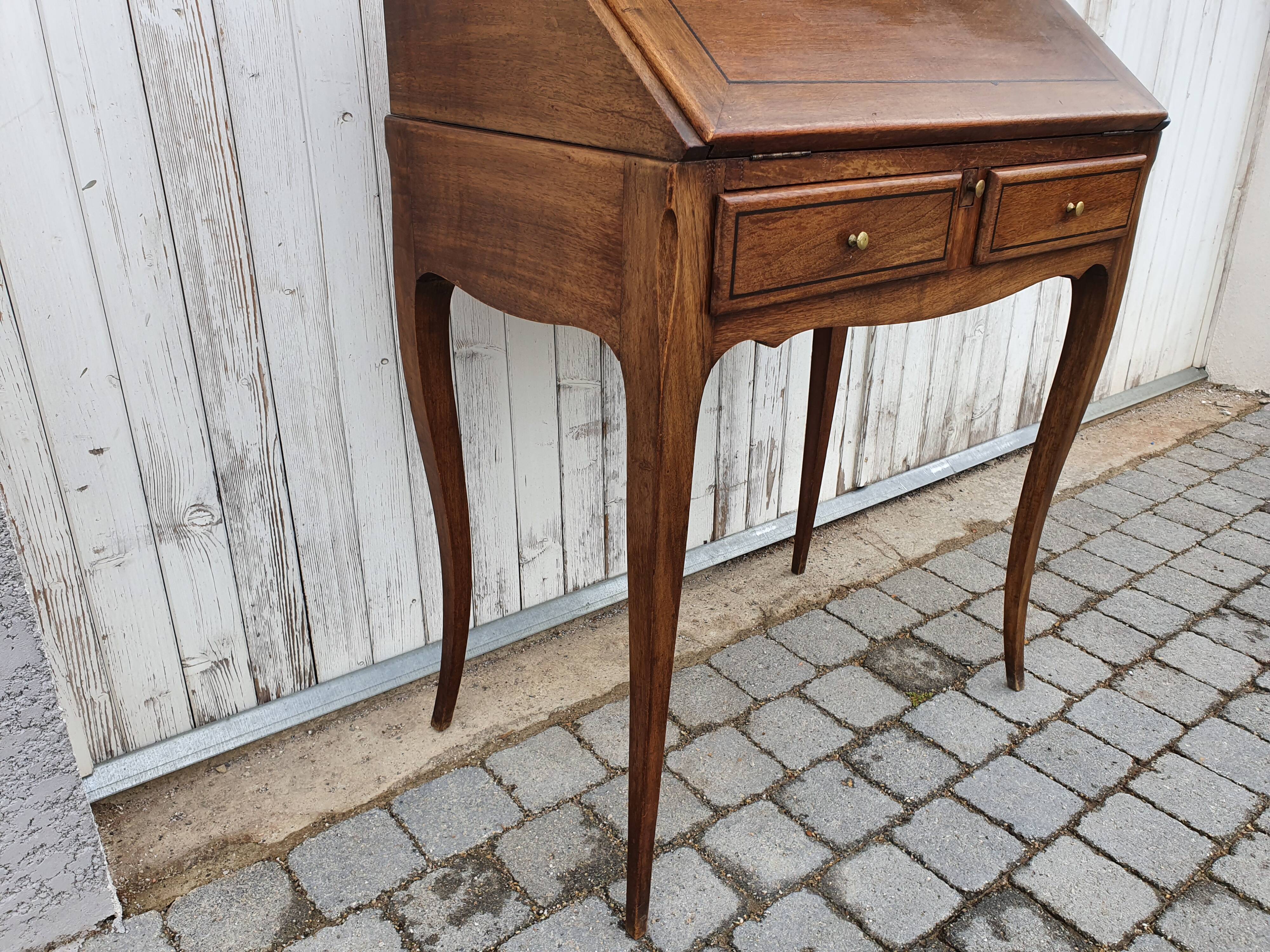 Former small secretary office with a walnut Louis XV