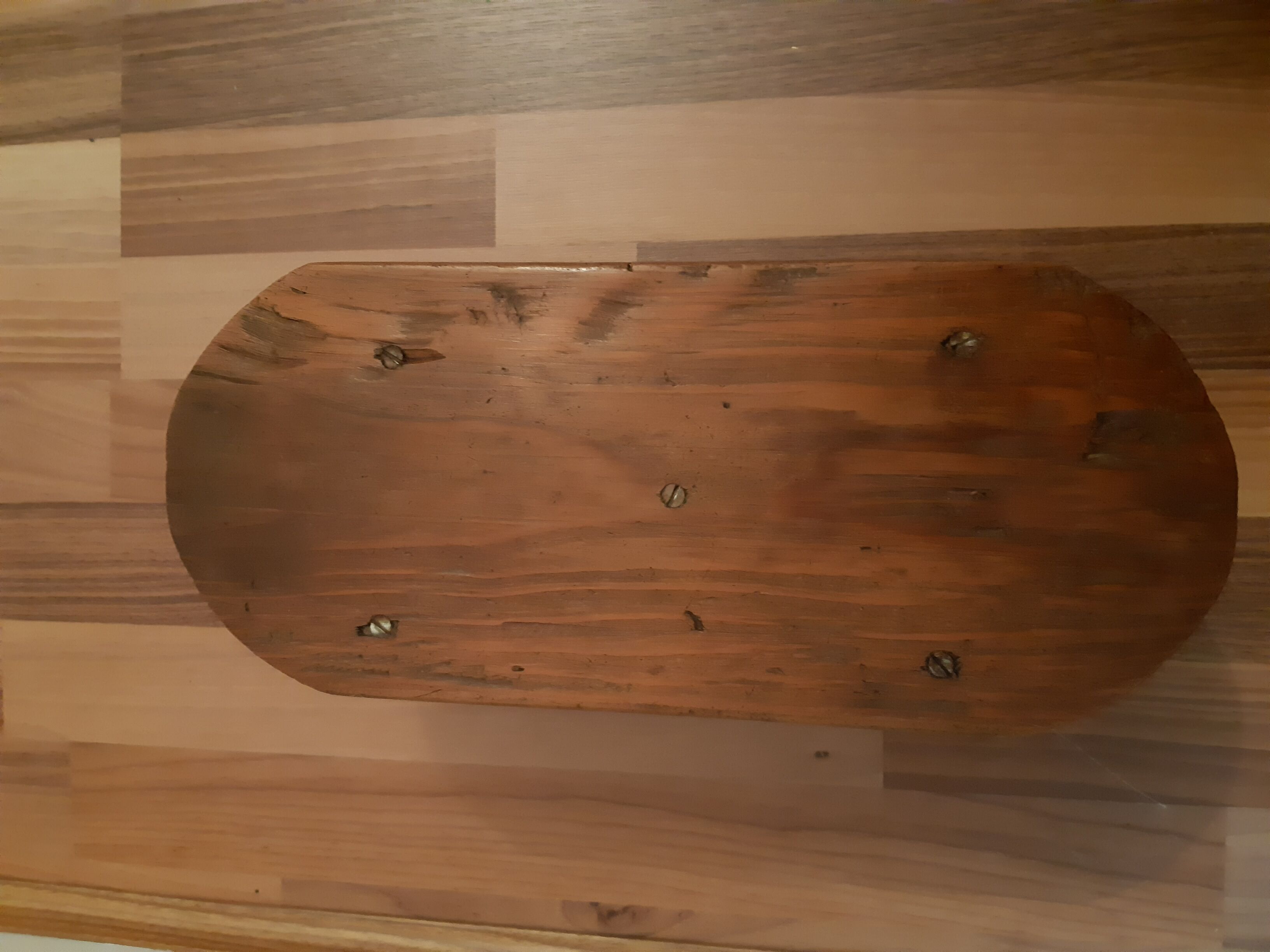Low milking stool in waxed wood