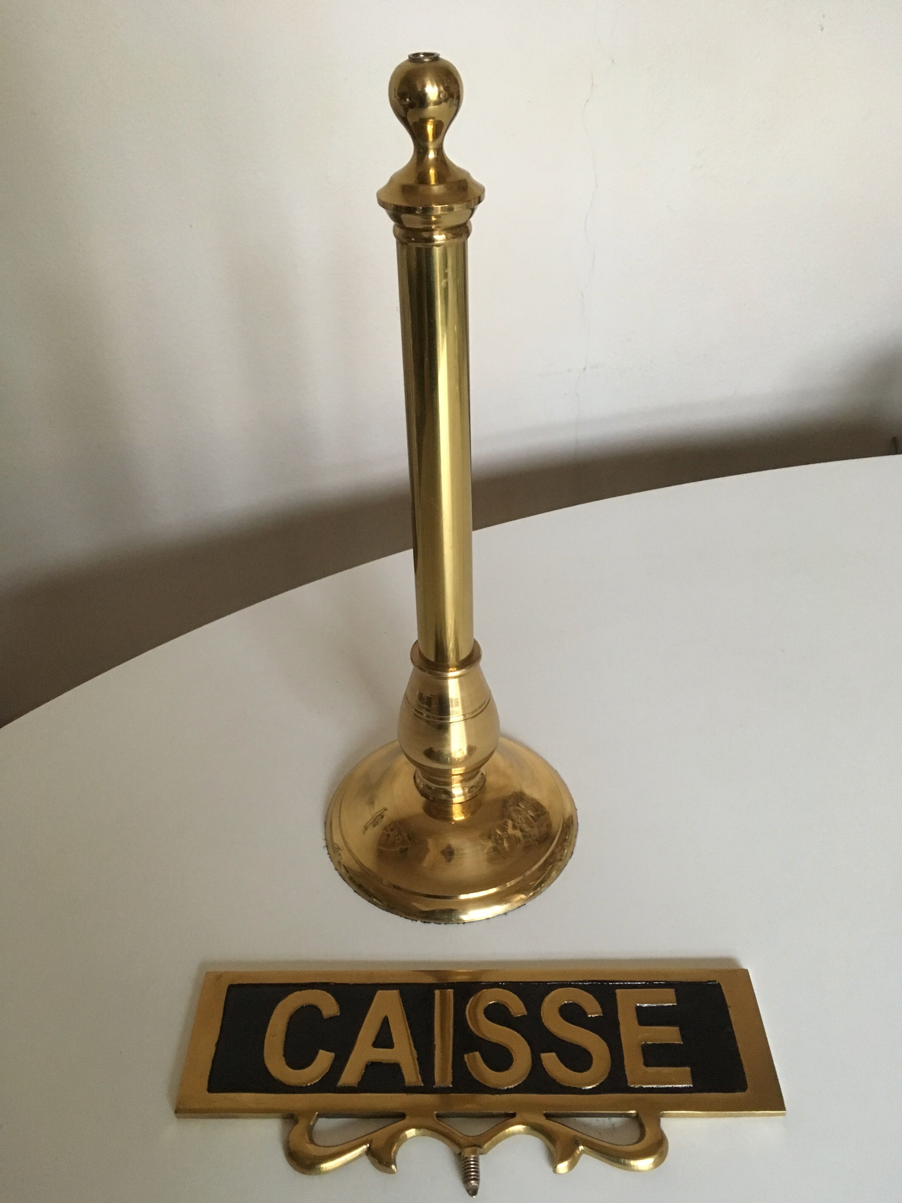 Brass palace brasserie counter plate on foot