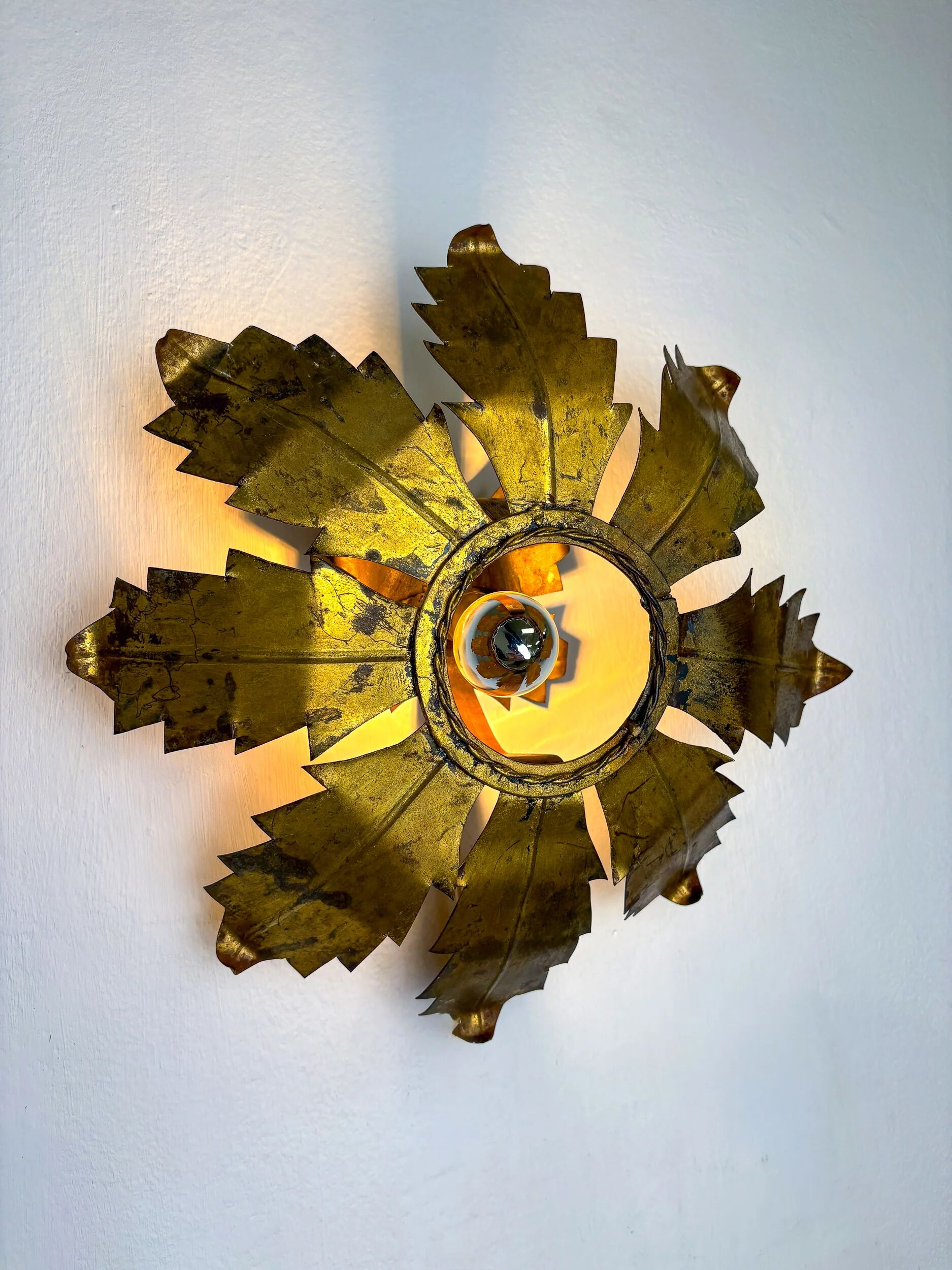 Spanish sunburst flush mount light fixture in gilt iron, circa 1970s