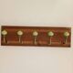 Wall-mounted coat rack with 5 hooks in sage green, stained wood and patinated metal – 50cm