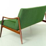 Dutch mid century 2-seater sofa with  teak legs and armrests