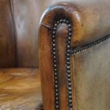 Club chair made of sheepskin leather with the most beautiful colors and a stunning patina