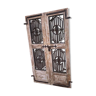 Old chiseled teak door with openwork wrought iron panels