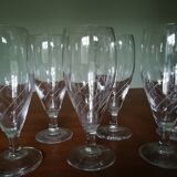 Eight champagne flutes in engraved glass