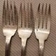 3 silver metal forks