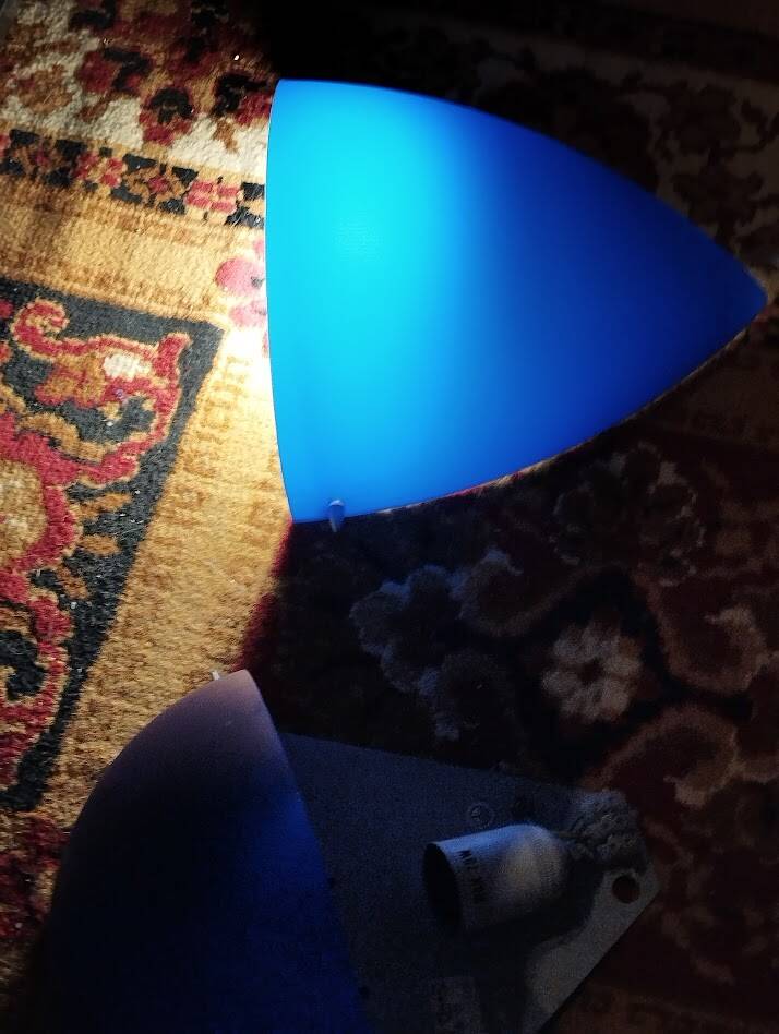 a pair of Ikea Kvintett wall lamps