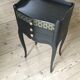 Bedside or nightstand painted black with patterns