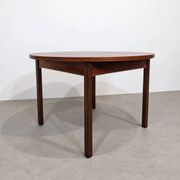 Extendable round rosewood dining table
