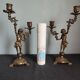 Pair of antique candlesticks in cherub bronze