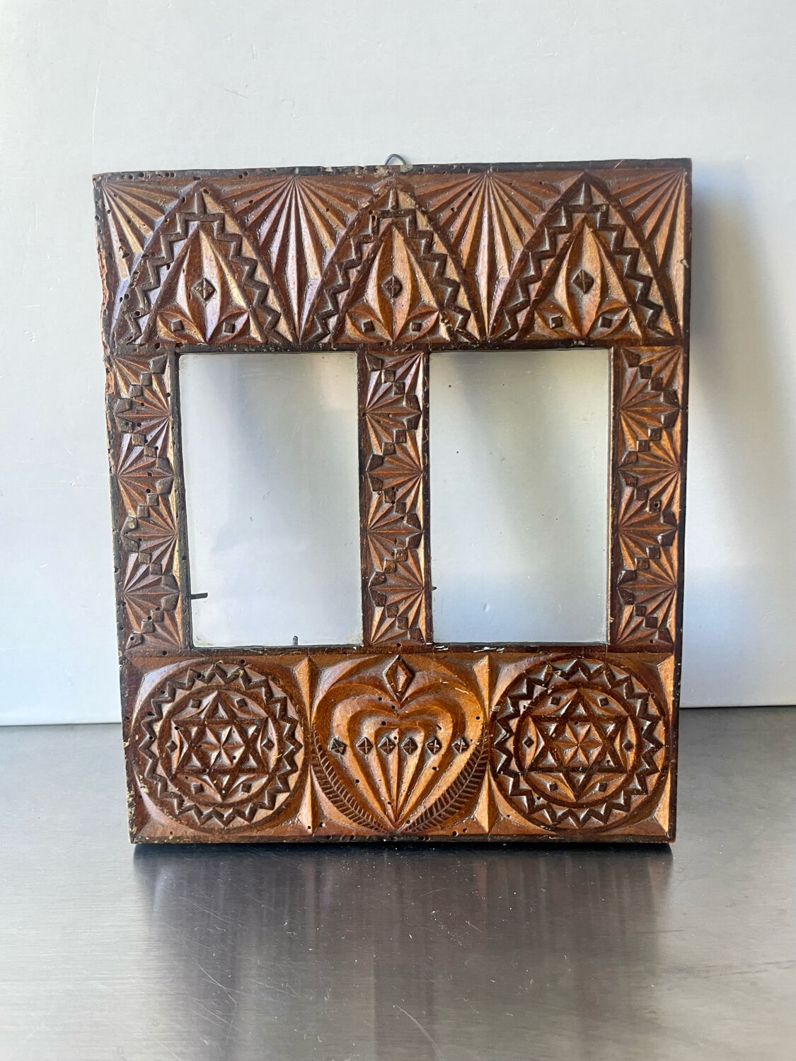 Double frame intricately carved wood
