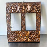 Double frame intricately carved wood