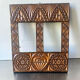 Double frame intricately carved wood