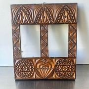 Double frame intricately carved wood