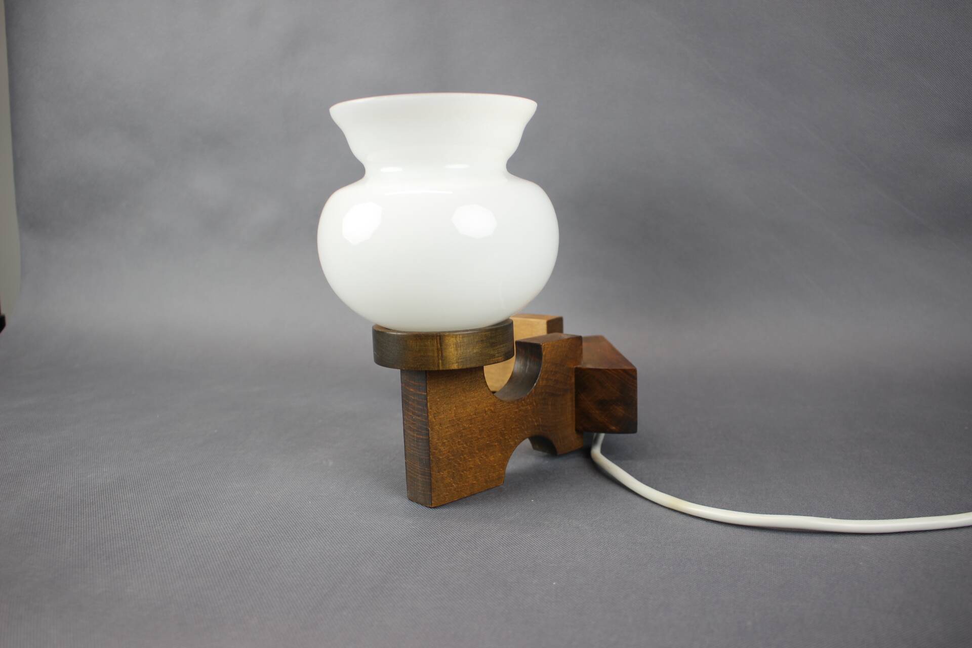 Czechoslovak wall lamp from the 1960s with Valasske Mezirici glass and a wooden base.