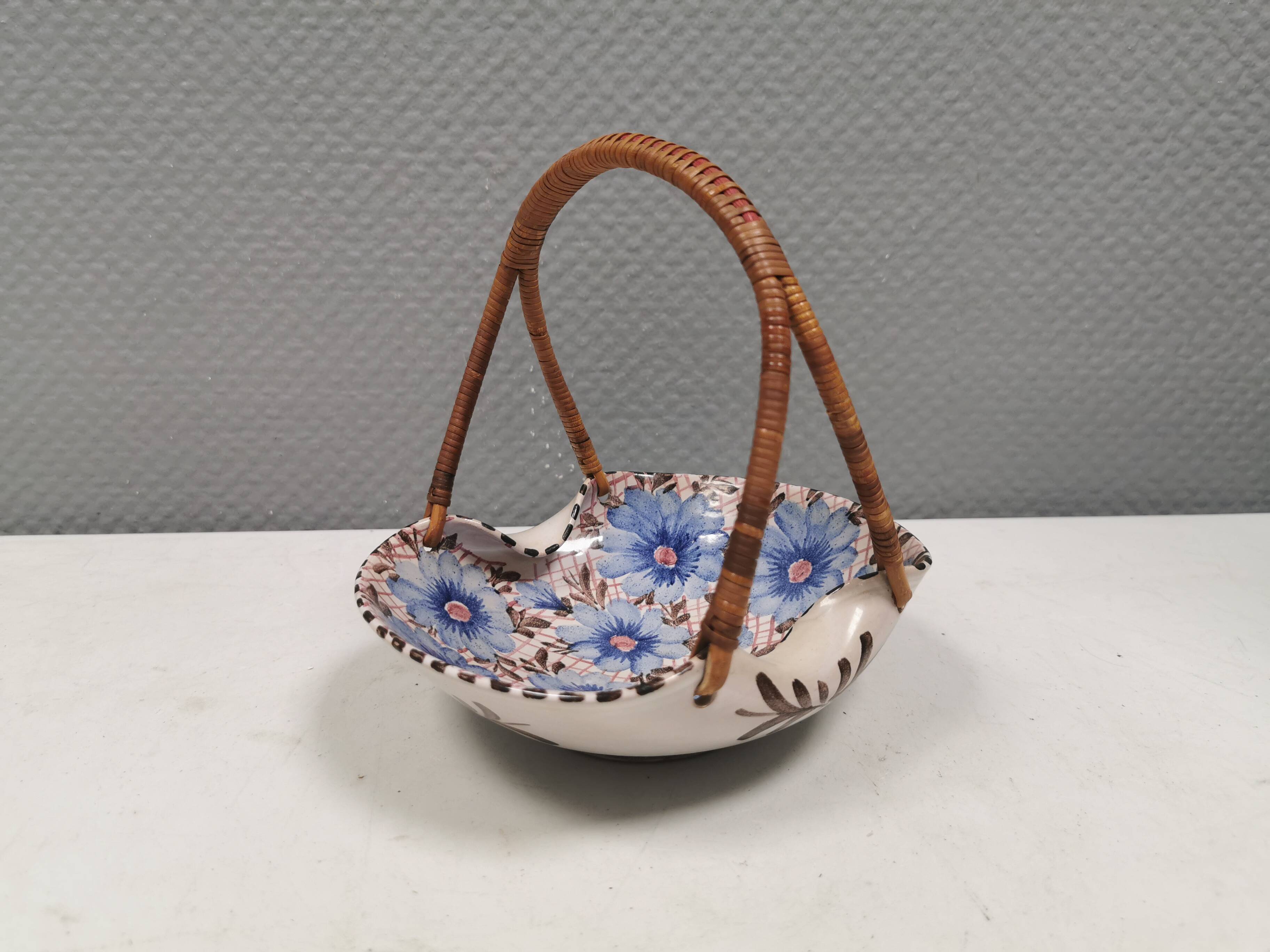 Beautiful small painted ceramic basket with woven handle
