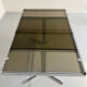 Smoked glass dining table with chrome legs, 1970s design by Roche Bobois.