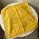 4 yellow napkins with white polka dots
