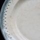 Round vintage patinated ironstone serving dish - Border model