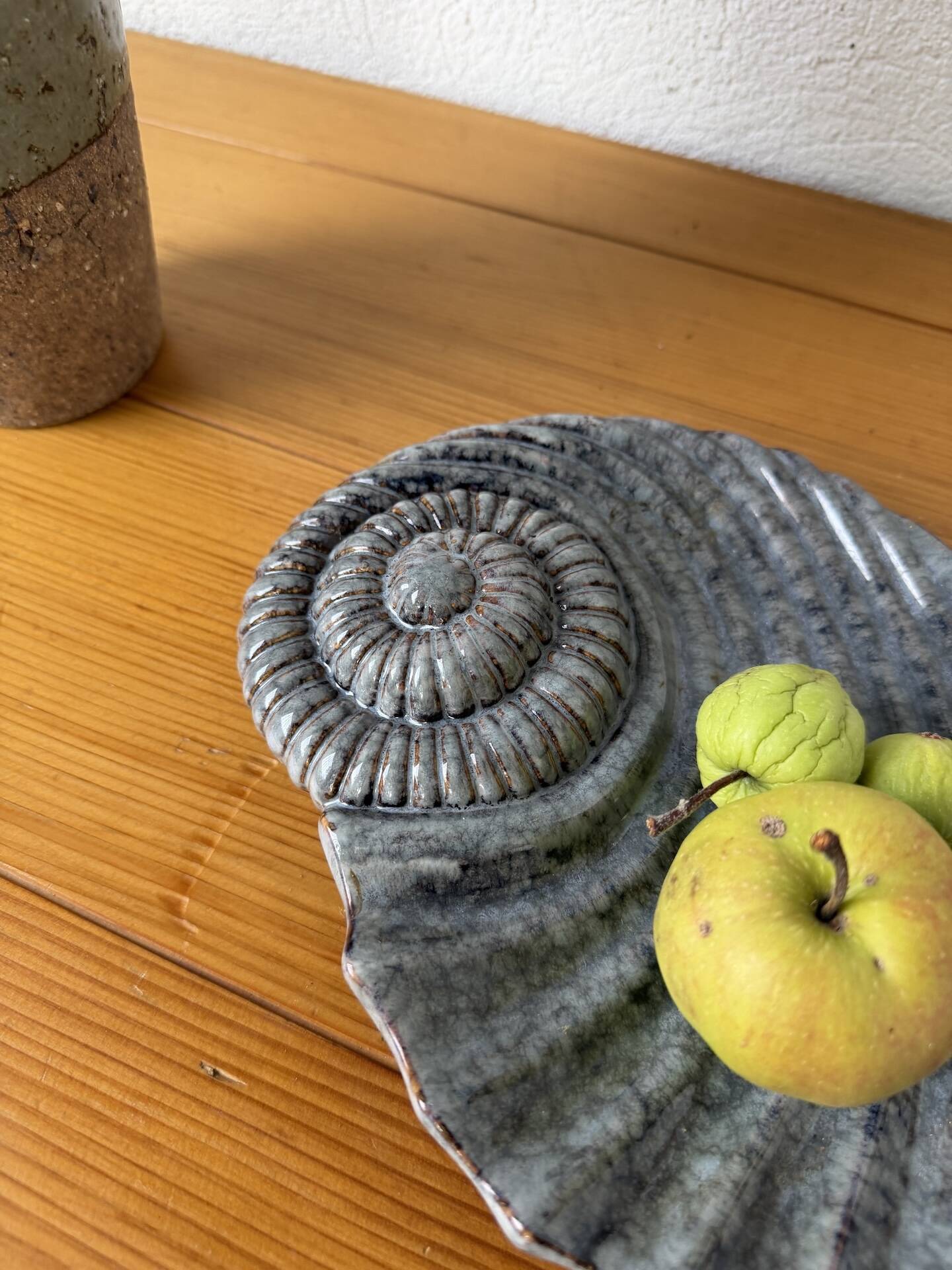 Shell-shaped ceramic catchall.