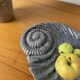 Shell-shaped ceramic catchall.