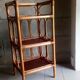 Shelf selette on wooden feet and vintage rattan