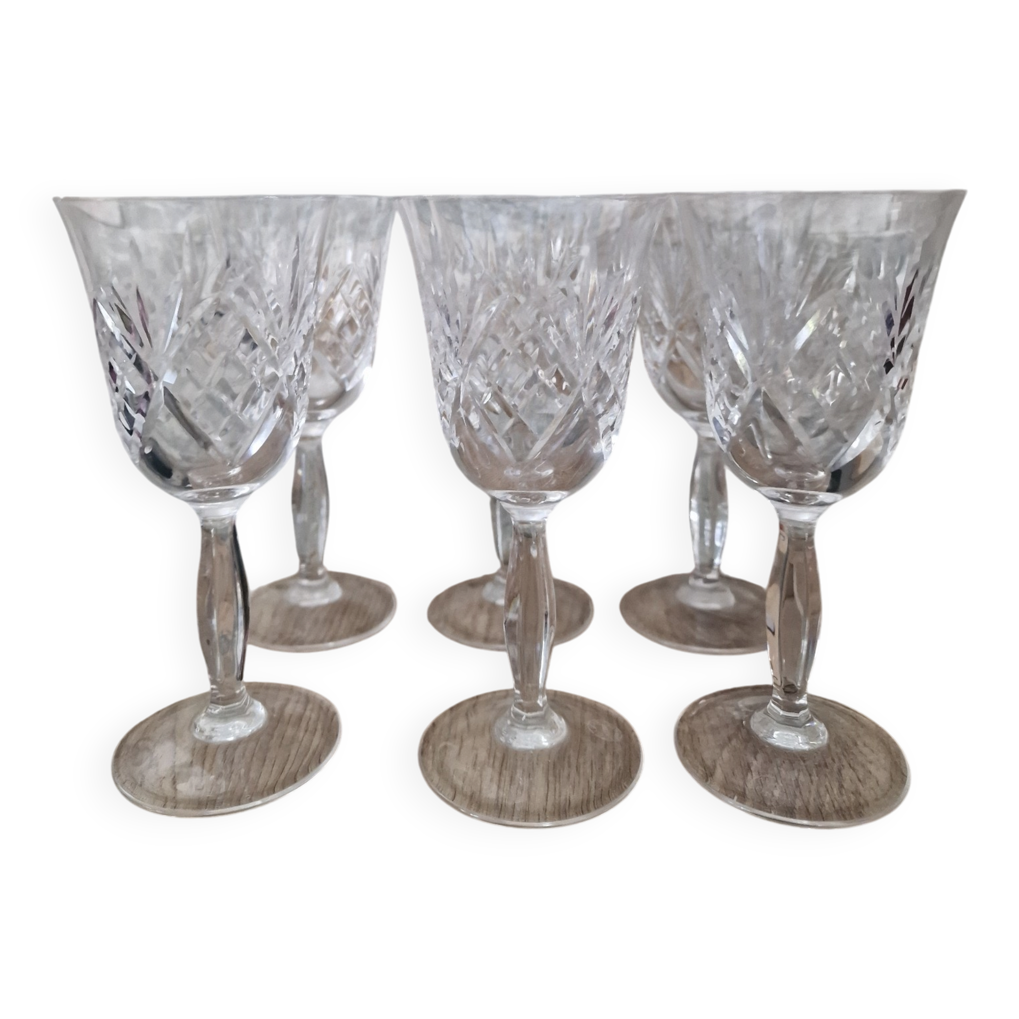 Set of 6 hand-cut crystal white wine glasses.