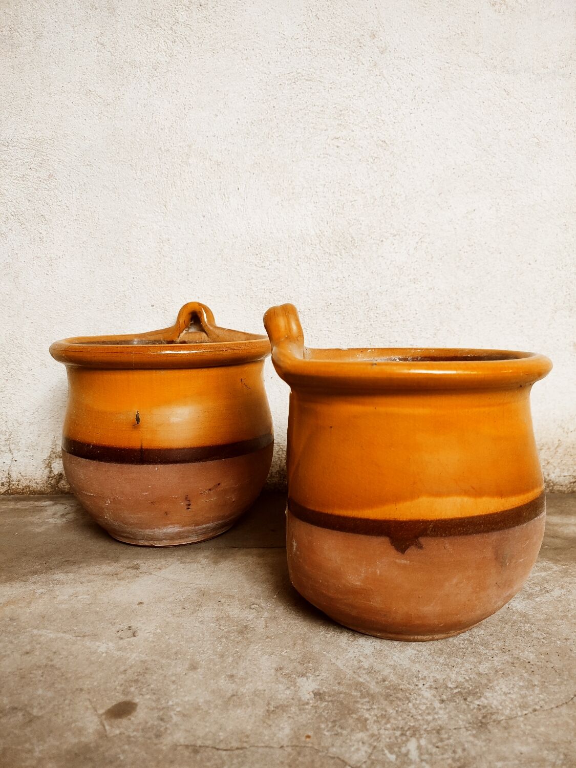 Duo of glazed terracotta pots