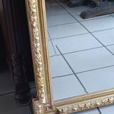 Antique mirror in wood and gilded stucco, neo Louis XVI style.