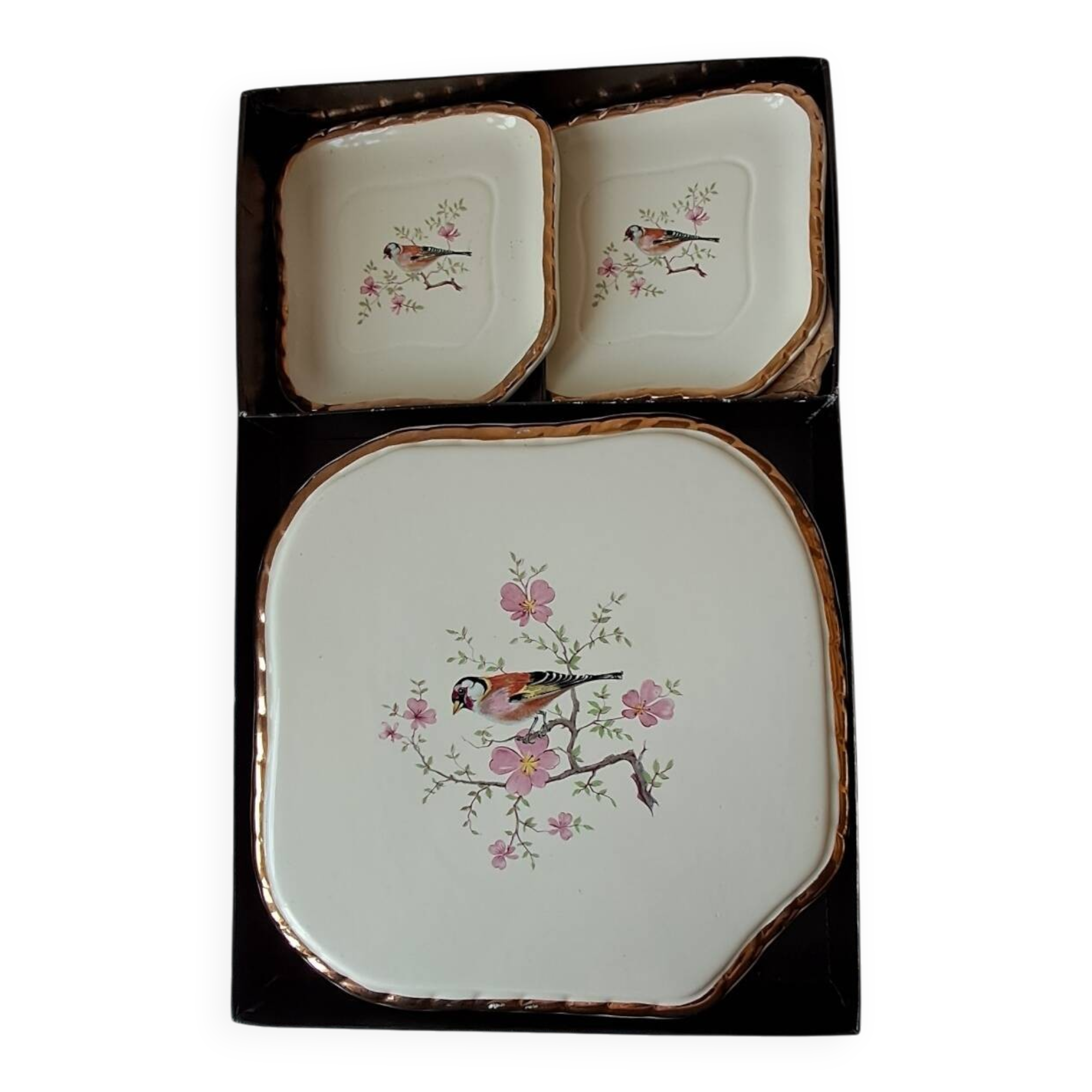 Trivet and bottle holder Salin, 1950s. Bird on branch.