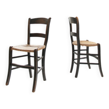 Pair of antique Northern French black-stained chairs with rush seats