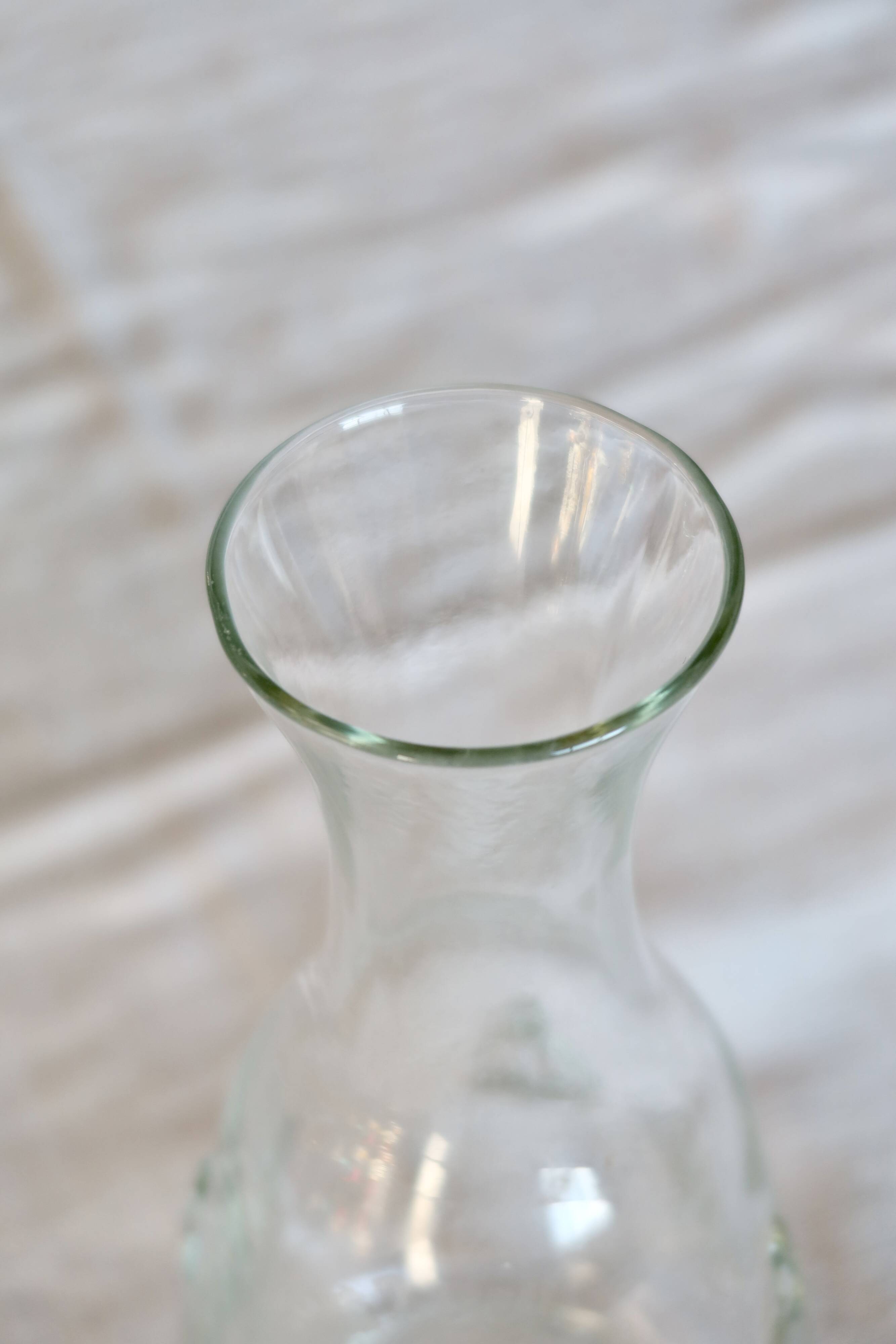 Vintage glass carafe with embossed bee motifs